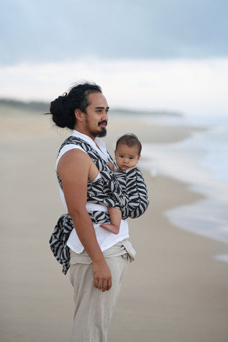 image of man holding baby