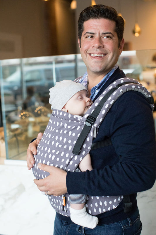 image of man holding baby