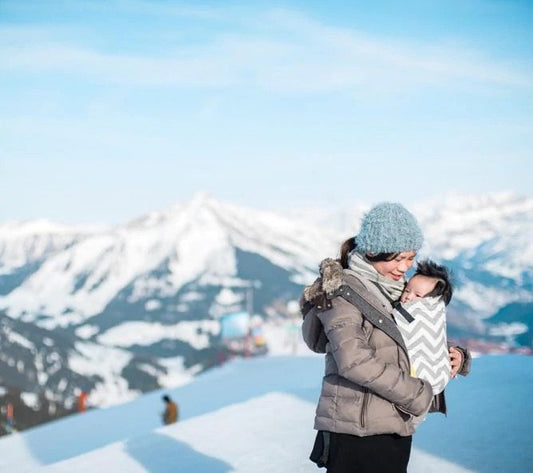 image of woman babywearing in the snow