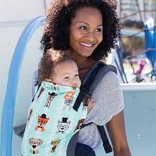 image of women wearing child outside