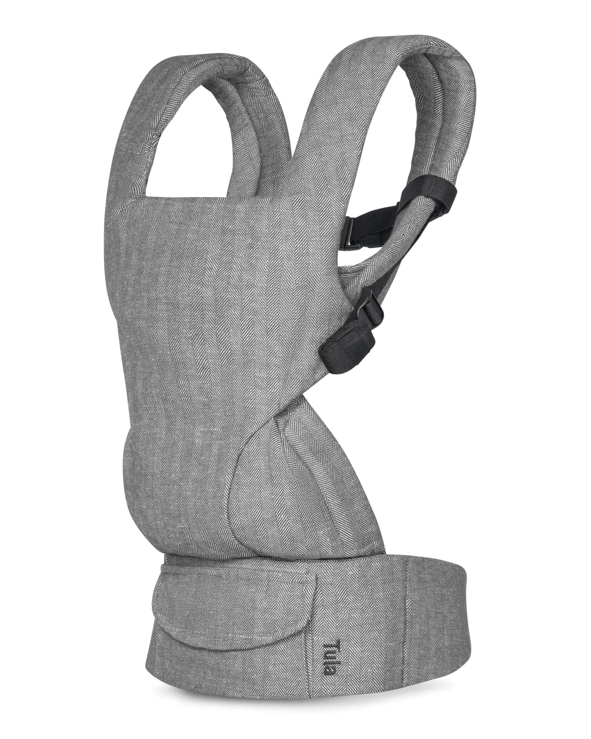 A light gray heathered linen baby carrier shown from the side against a plain white background. The carrier features padded shoulder straps, a structured waist belt, and a small black brand label near the bottom.