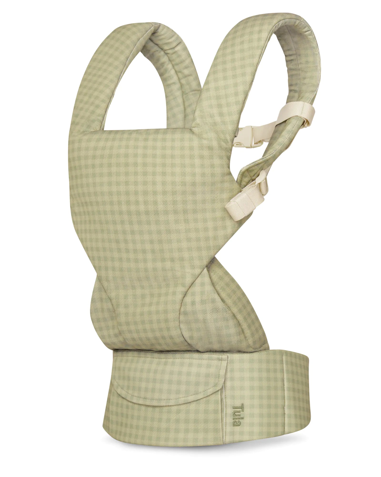 A mesh baby carrier in a light sage green and white gingham check pattern, shown from the back on a white background. The brand name 'Tula' is subtly printed on the lower right waist belt.