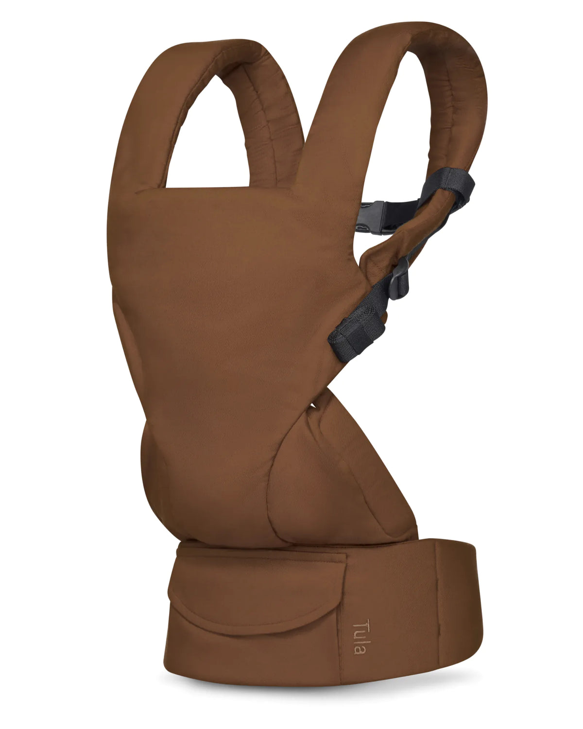A brown linen baby carrier shown from a side profile view on a clean white background. The product features a padded design with adjustable shoulder straps and a waist strap, with the brand name 'Tula' visible on the lower right.