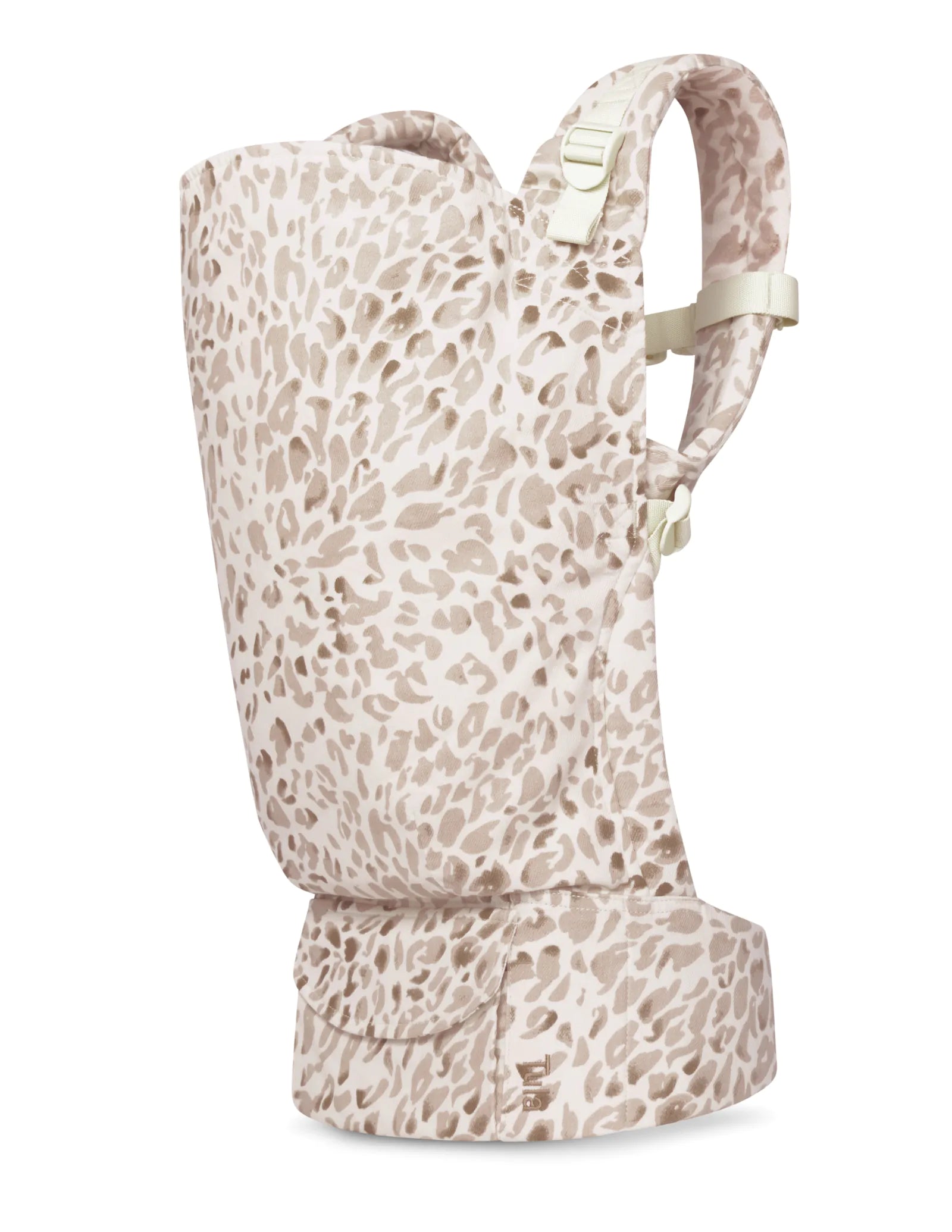 A toddler carrier with a beige and cream leopard print pattern, shown from a side profile view against a plain white background.