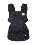 A baby carrier seat belt featuring a black fabric with a light gray star pattern, shown against a plain white background. The brand name 'tula' is visible on a small white label on the upper right side.