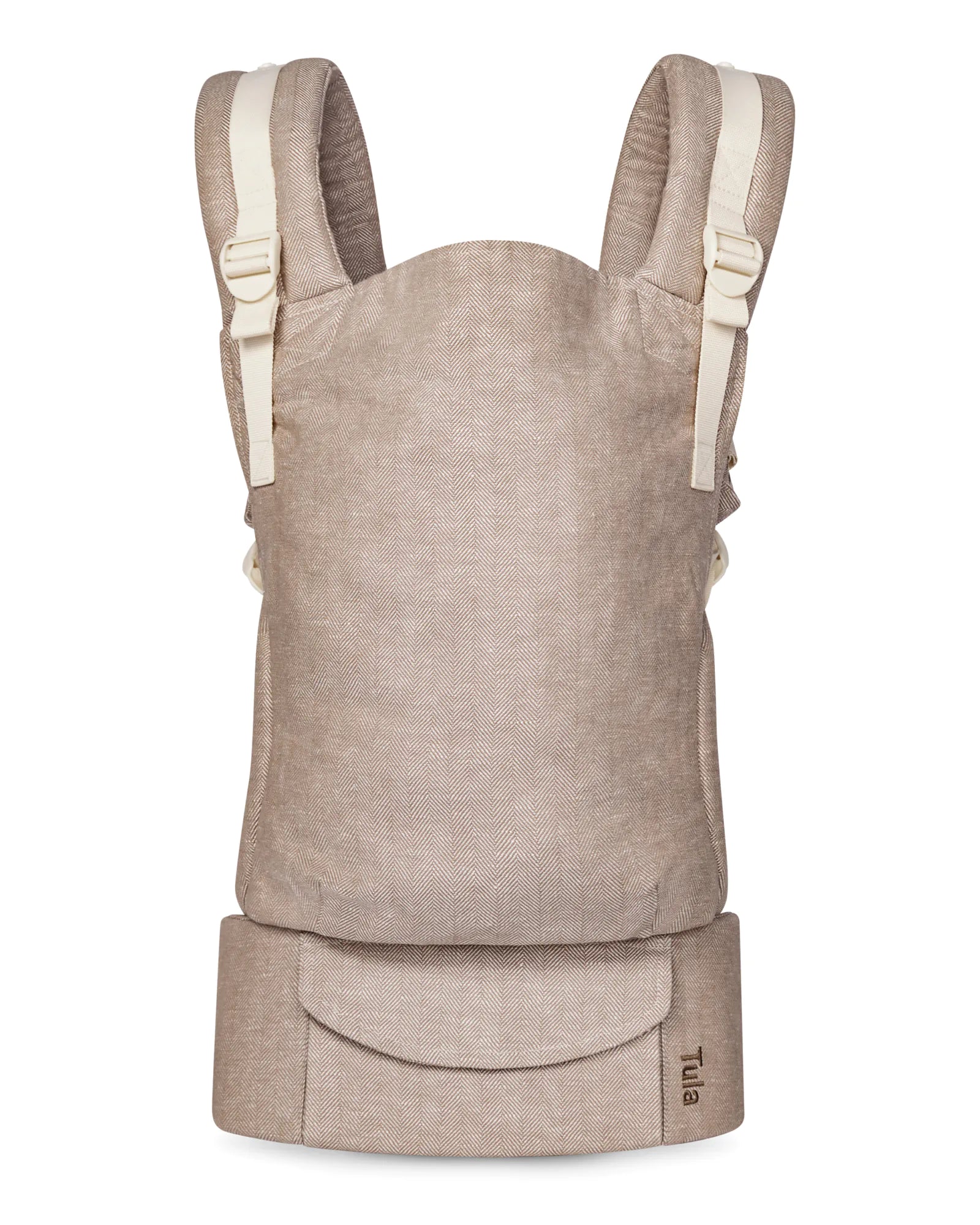 A structured linen baby carrier bag in a heathered taupe-beige fabric, featuring cream-colored shoulder straps and a matching bottom waist belt, shown against a plain white background.