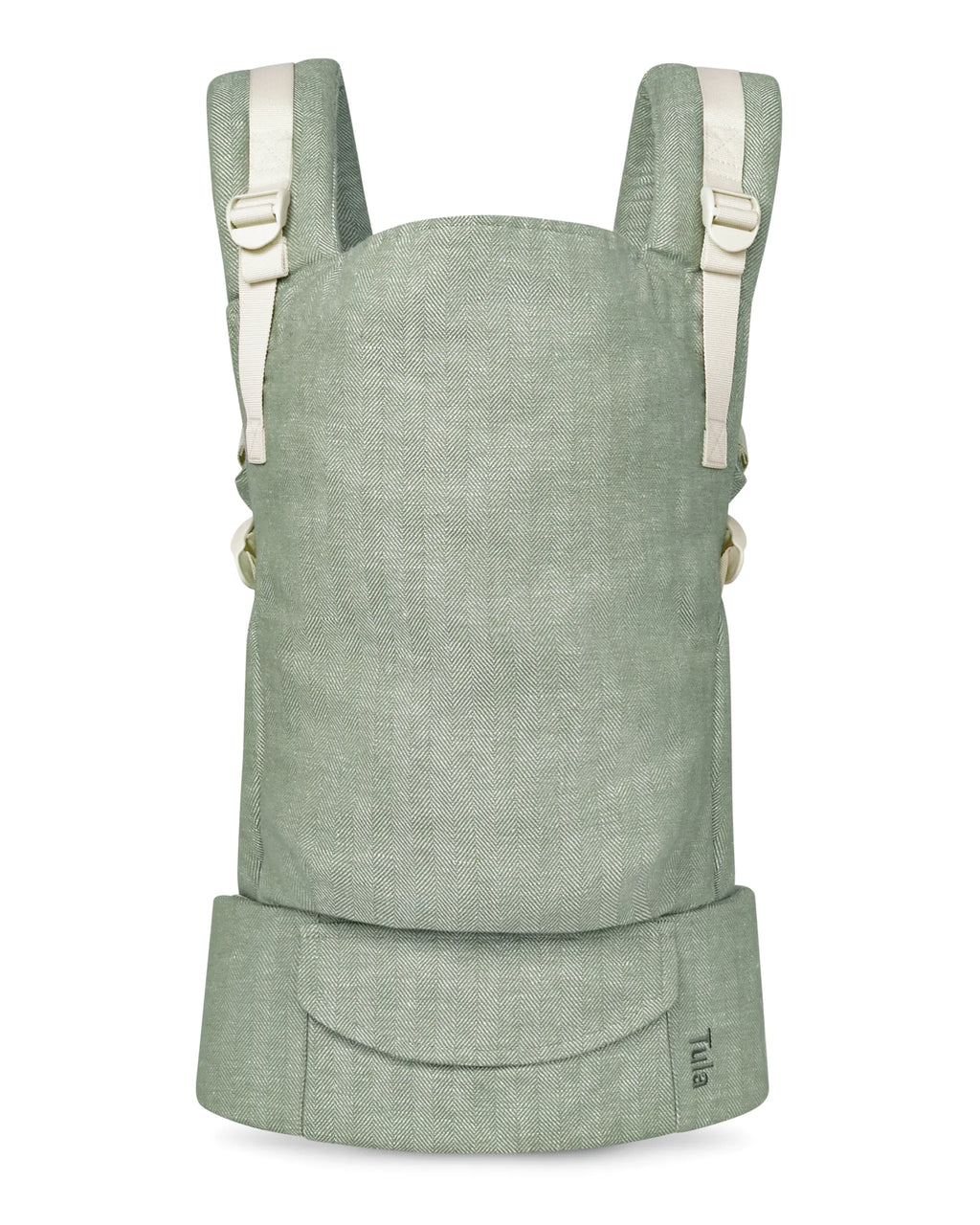 A sage green linen baby carrier with cream-colored shoulder straps and a front utility pocket, shown against a plain white background.