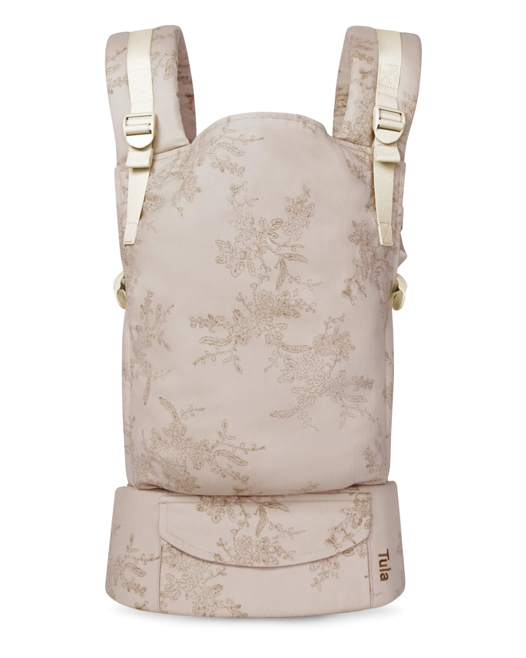 A cotton original baby carrier in a light beige fabric with a delicate floral toile pattern, featuring cream-colored shoulder straps and side buckles, and a matching waist belt at the bottom.