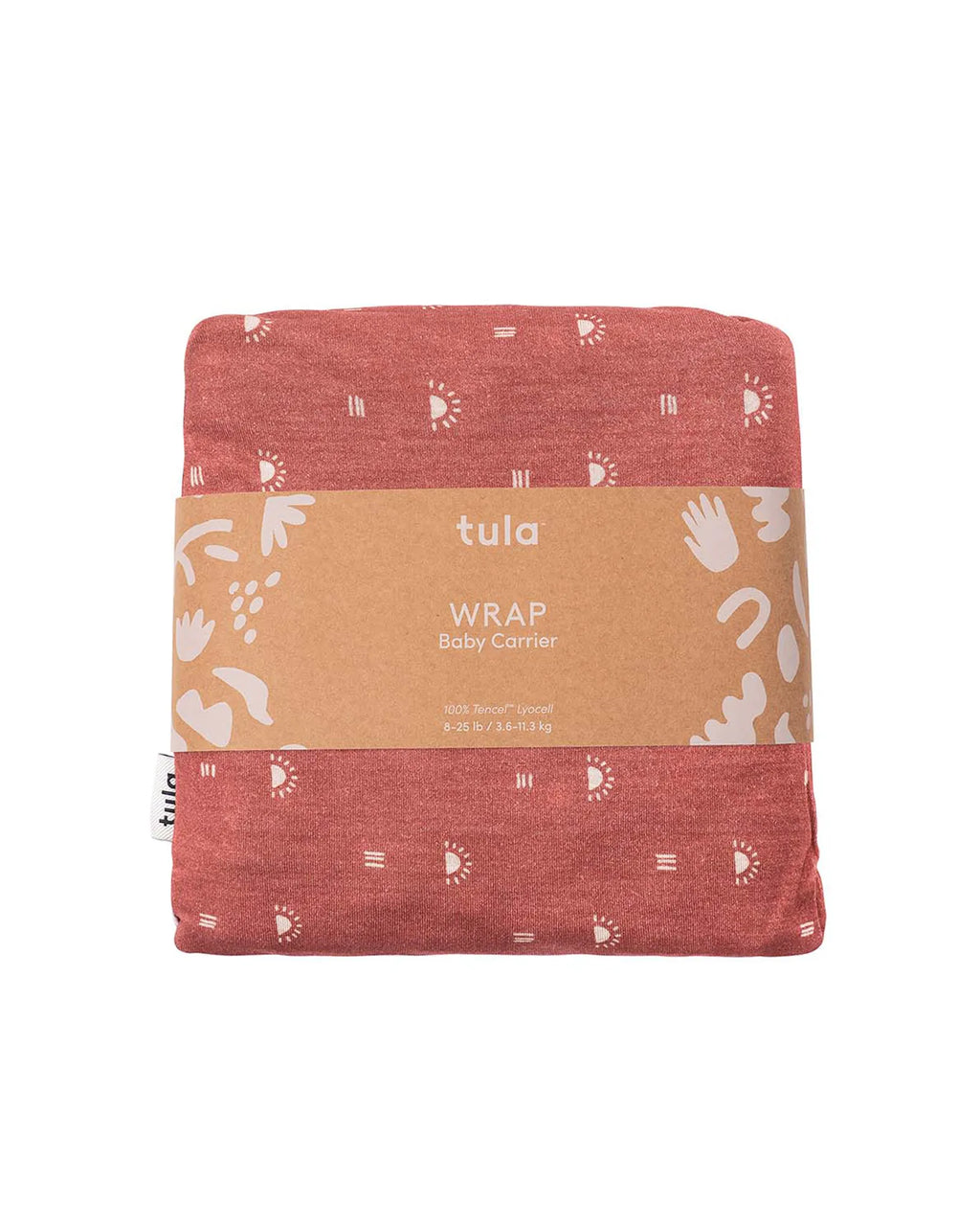 A folded Tula baby wrap in a heathered terracotta red color, featuring a white hand-drawn style sun, moon, and footprint pattern. It is wrapped in a brown kraft paper band with the brand name 'tula' and product details 'WRAP Baby Carrier'.
